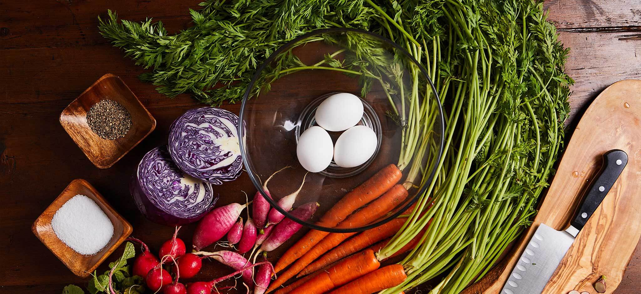 Fresh Eggs and Colorful Root Vegetables on Wooden Table