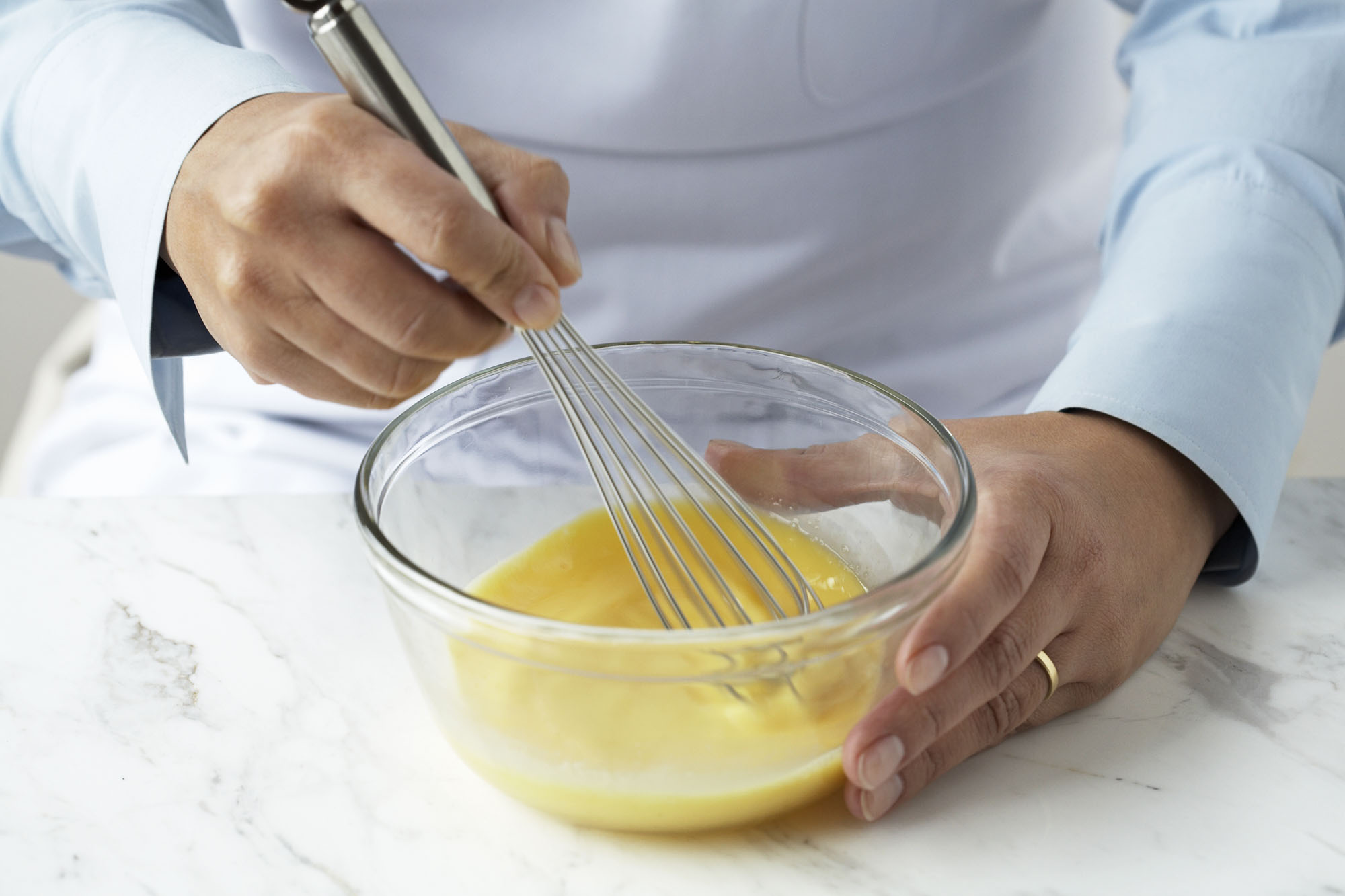 whisking eggs in a bowl