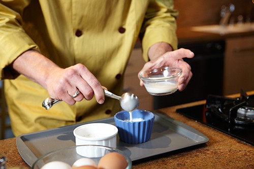 measuring eggs into ramekins