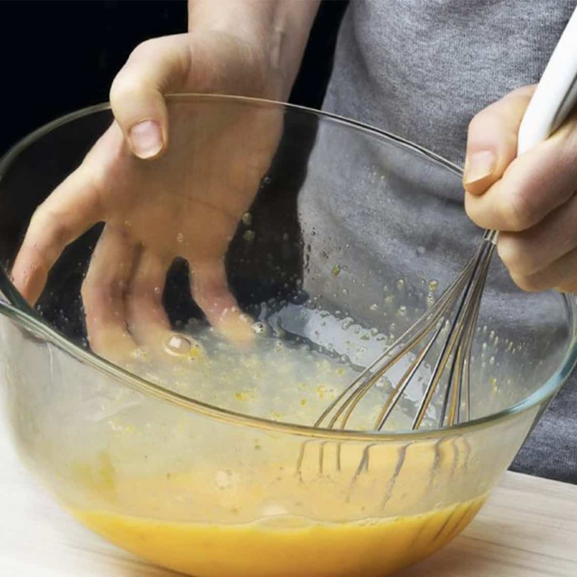 whisking eggs in a bowl