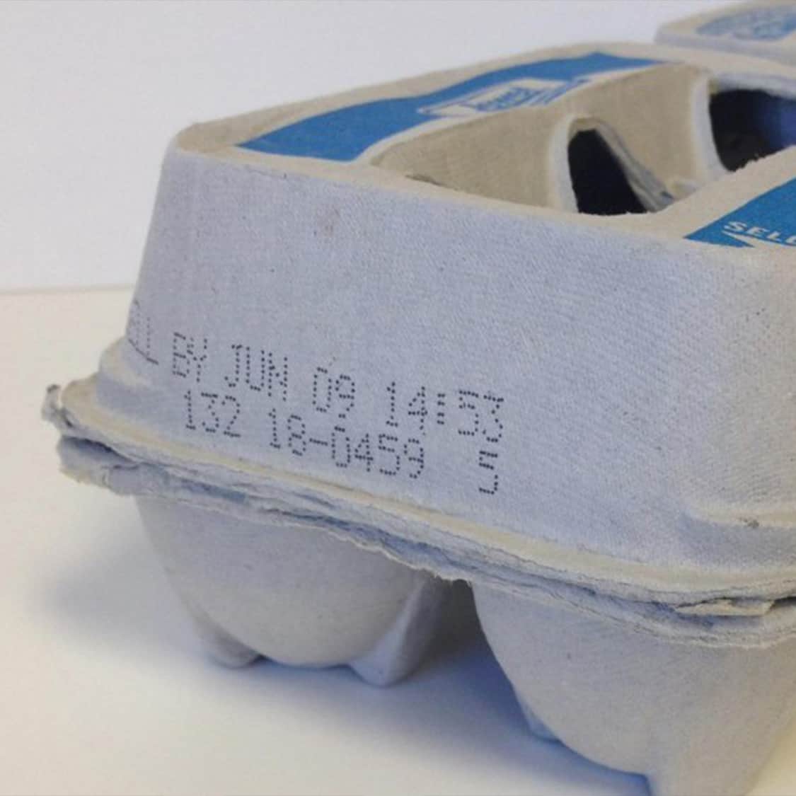 closeup of egg carton showing the julian date