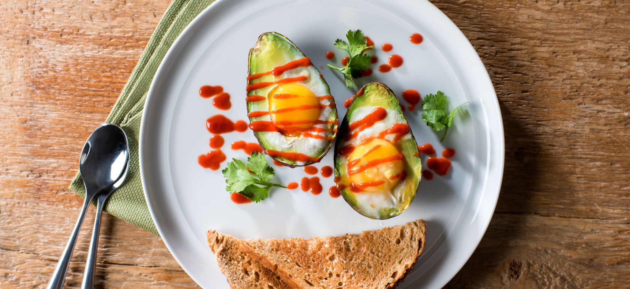 Spicy Sriracha Baked Avocado Eggs