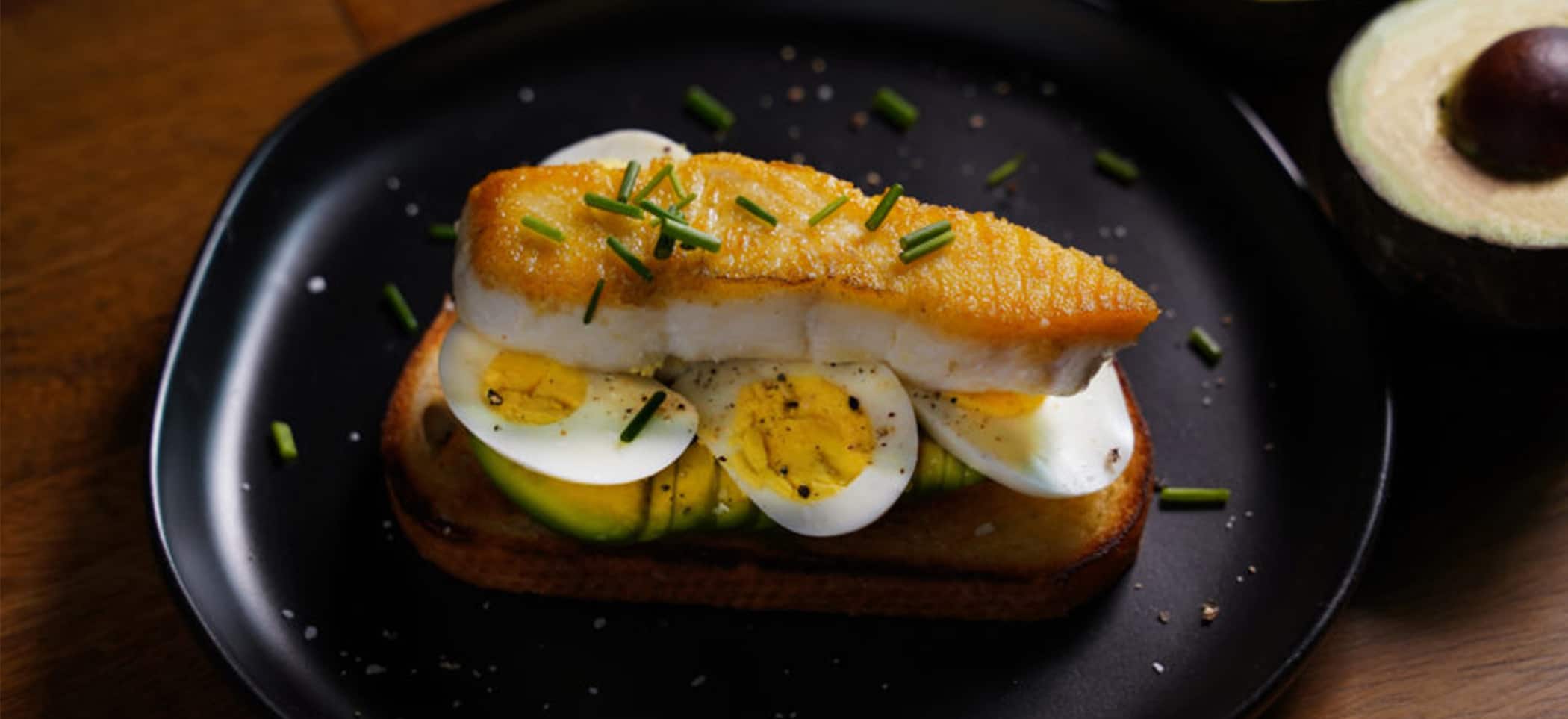 Sliced Egg Avocado Toast with White Fish