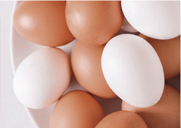 brown and white eggs in a bowl