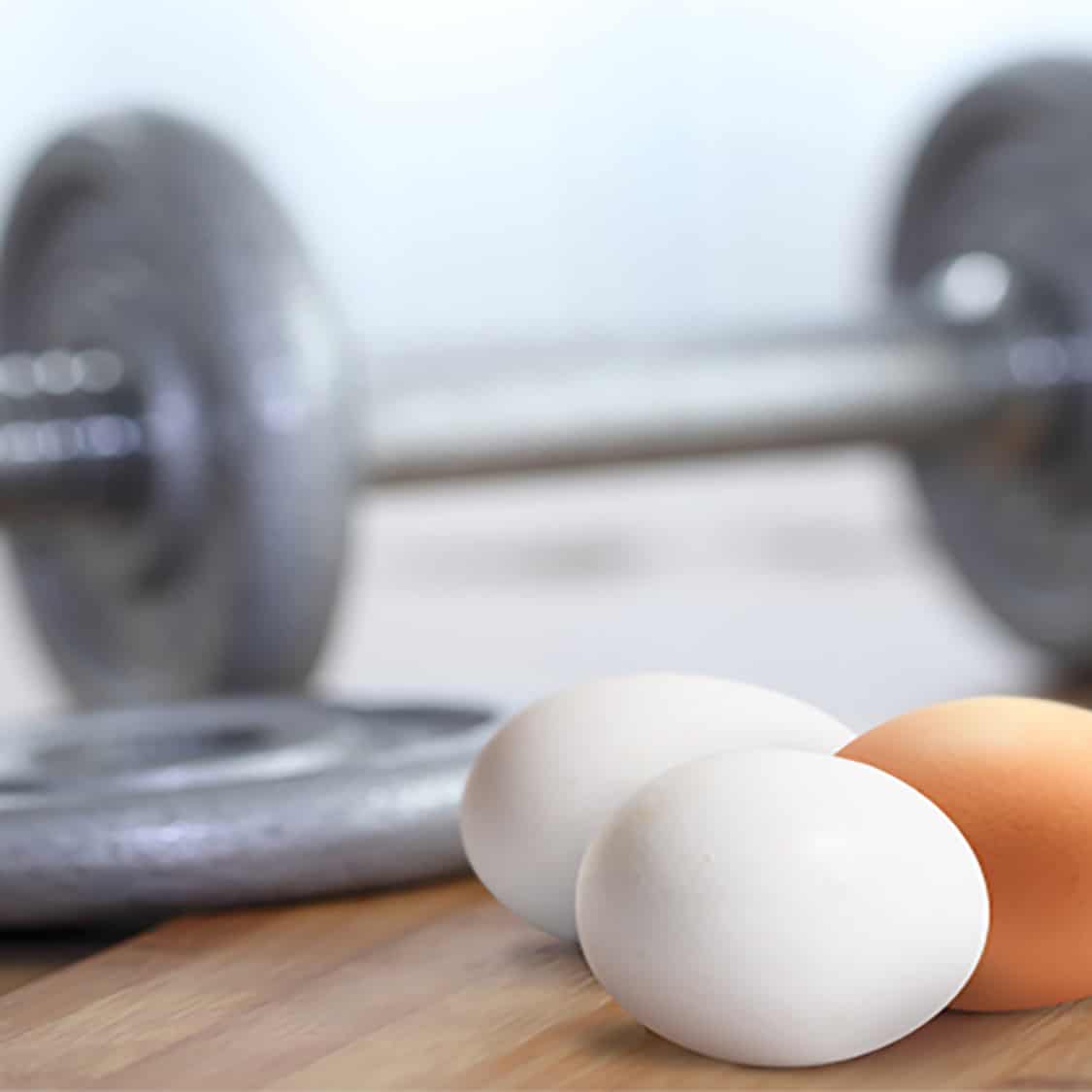eggs next to a barbell