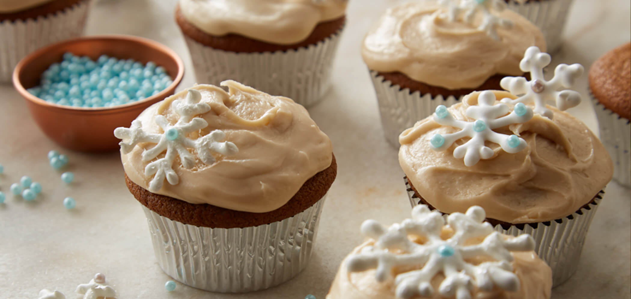 Gingerbread cupcakes with winter snowflake decorations