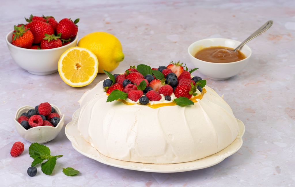 Summer Berry Pavlova Topped with Fresh Berries and Lemon Curd